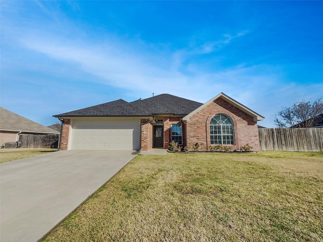 single story home featuring an attached garage, brick siding, fence, concrete driveway, and a front lawn