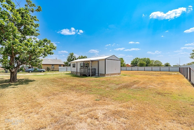 view of yard featuring a fenced backyard and an outdoor structure