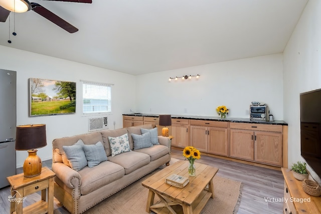 living room with ceiling fan and light wood-type flooring