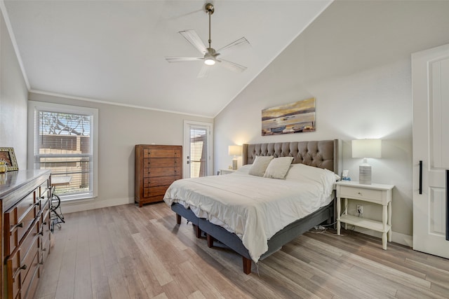 bedroom featuring crown molding, light wood finished floors, a ceiling fan, vaulted ceiling, and baseboards