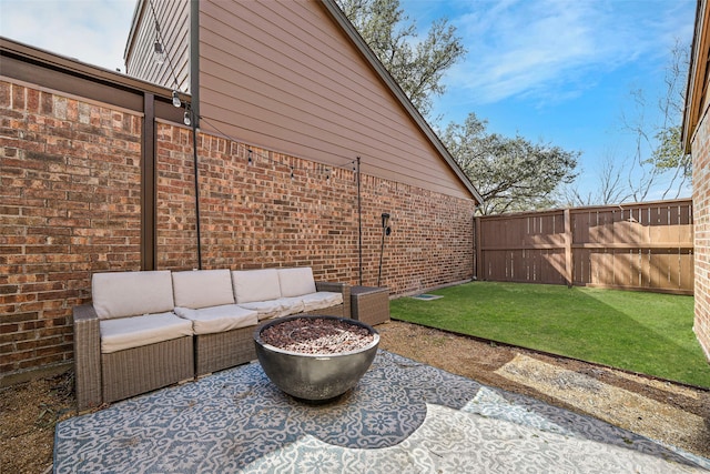 view of patio / terrace with a fenced backyard and an outdoor living space