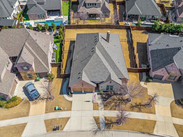 birds eye view of property with a residential view