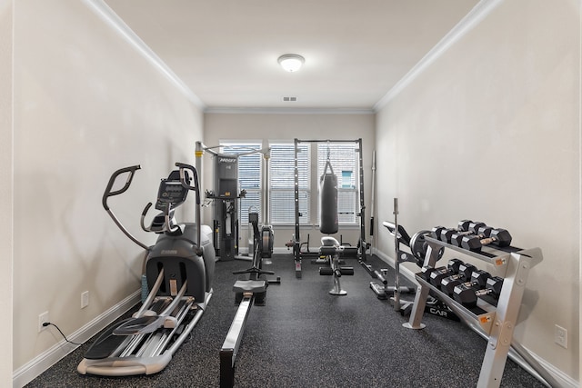 exercise area with ornamental molding, visible vents, and baseboards