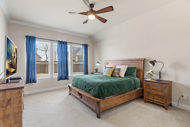 carpeted bedroom with lofted ceiling, ceiling fan, ornamental molding, and baseboards