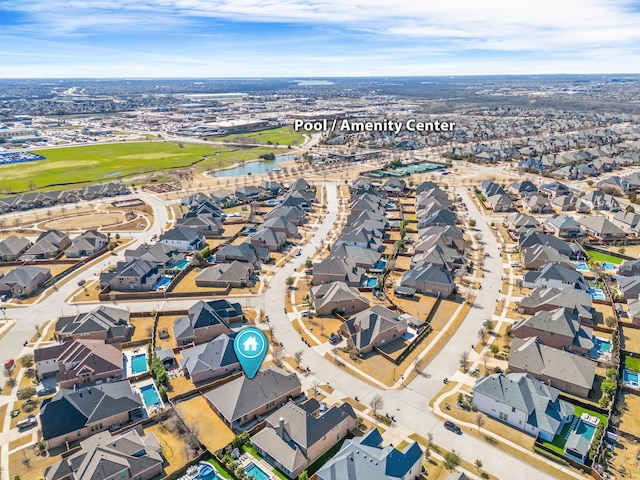 birds eye view of property featuring a residential view and a water view