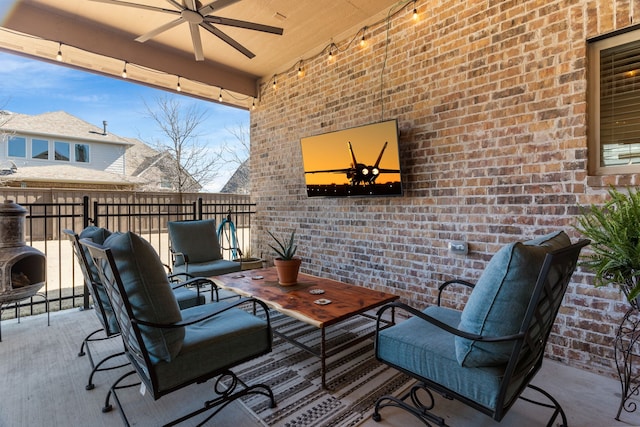 view of patio featuring ceiling fan