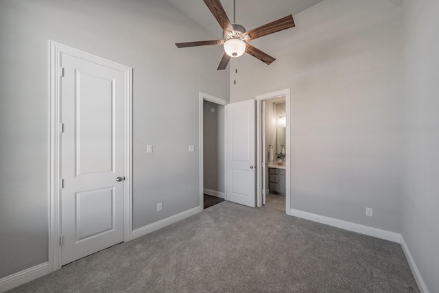 unfurnished bedroom featuring a ceiling fan, carpet, ensuite bath, and baseboards