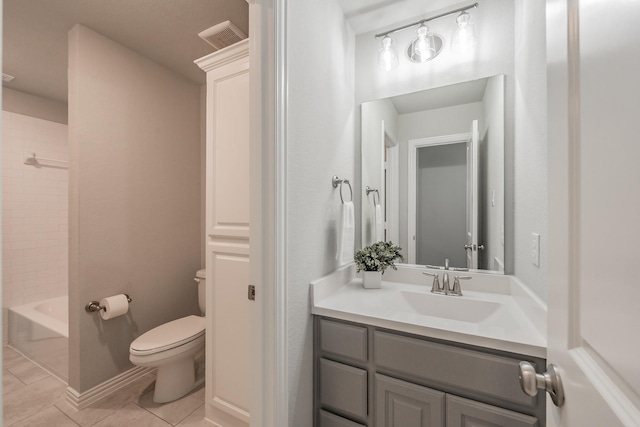 bathroom with visible vents, toilet, vanity, tile patterned flooring, and baseboards