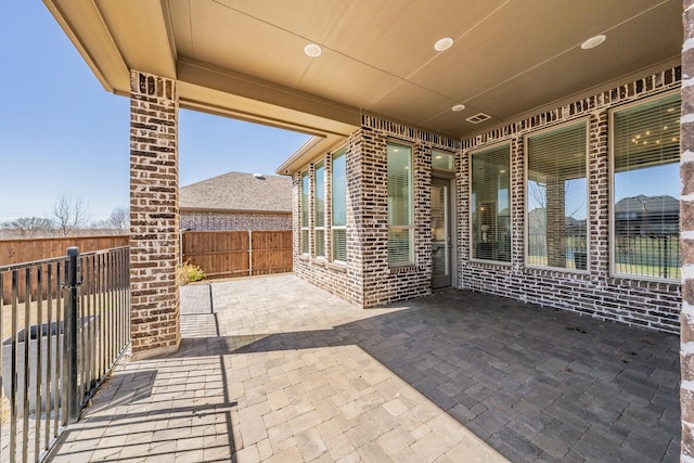 view of patio / terrace with a fenced backyard and visible vents