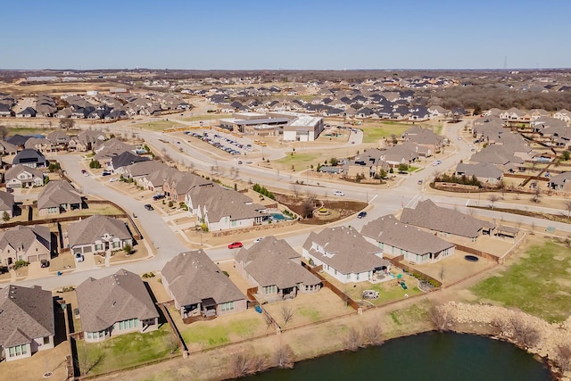 aerial view featuring a residential view and a water view