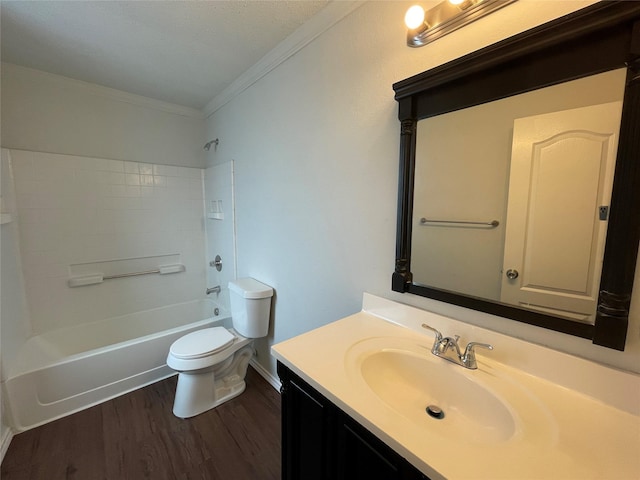 full bathroom featuring toilet, ornamental molding, vanity, wood finished floors, and  shower combination