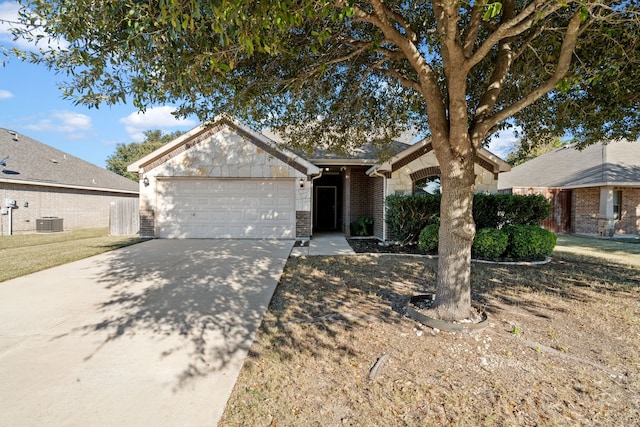 ranch-style home featuring brick siding, cooling unit, concrete driveway, and a garage