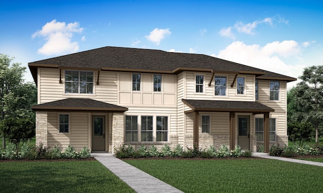 view of front of home featuring stone siding, a shingled roof, and a front yard