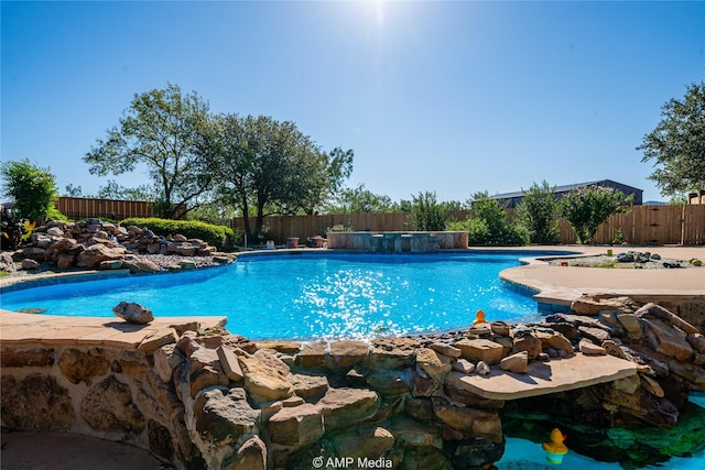 view of pool with a fenced backyard and a fenced in pool