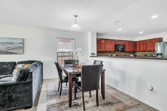 dining area with recessed lighting, baseboards, and light tile patterned flooring