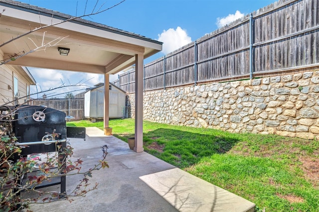 view of patio / terrace featuring a fenced backyard, an outdoor structure, and a shed