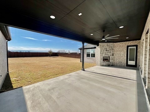 view of patio / terrace featuring a ceiling fan and fence