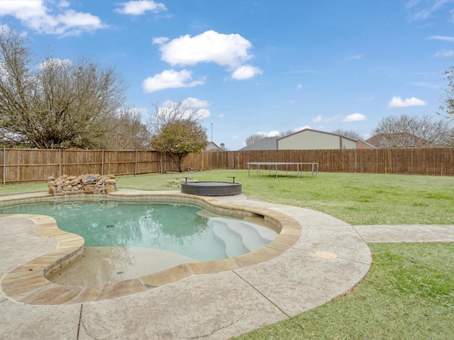 view of pool featuring a trampoline, a fenced in pool, a yard, a patio area, and a fenced backyard