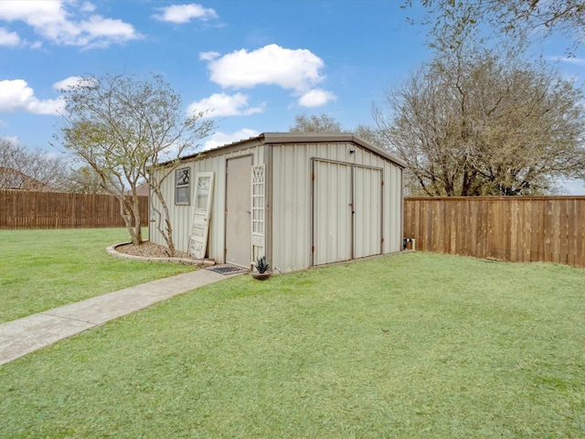 view of shed with a fenced backyard