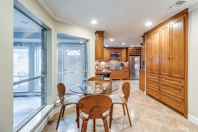 dining area with baseboards, recessed lighting, visible vents, and crown molding