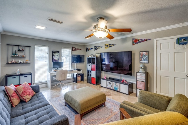 living room featuring a ceiling fan, visible vents, crown molding, and a textured ceiling