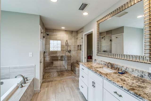 full bath with a garden tub, a shower stall, visible vents, and vanity