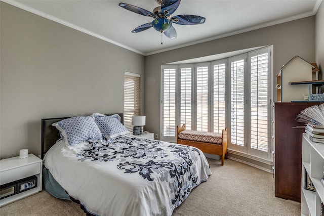 bedroom featuring light carpet, ornamental molding, and a ceiling fan