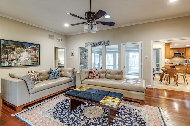 living room featuring crown molding, recessed lighting, visible vents, ceiling fan, and wood finished floors