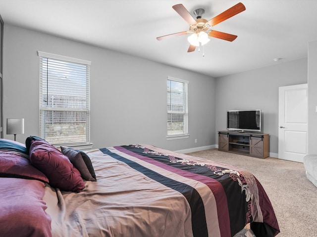 bedroom featuring a ceiling fan, carpet flooring, and baseboards