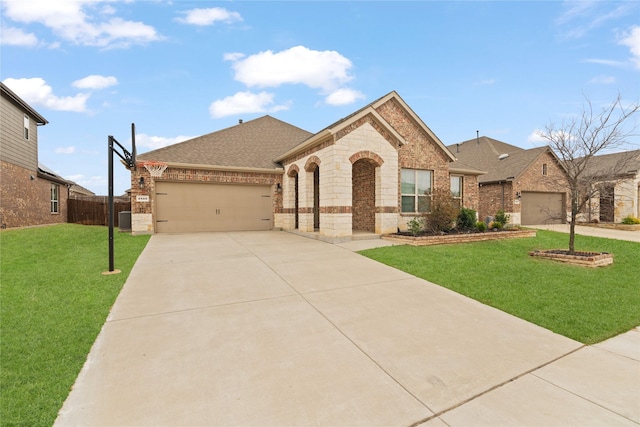 french country home featuring concrete driveway, roof with shingles, an attached garage, a front lawn, and brick siding