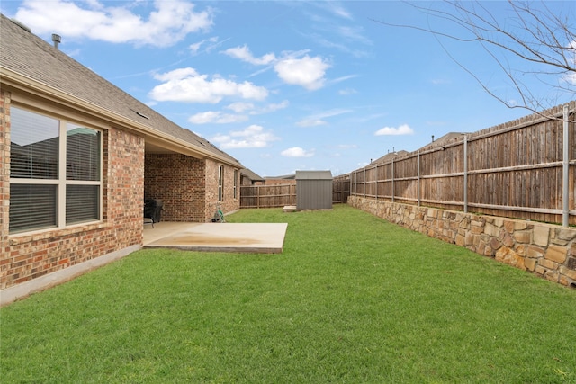 view of yard featuring a patio area, an outdoor structure, a fenced backyard, and a shed