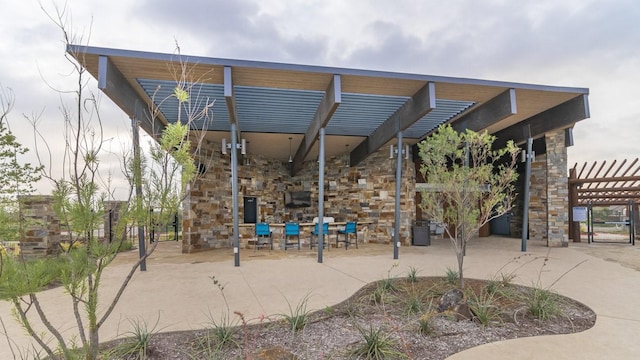 view of property's community featuring a patio and a pergola