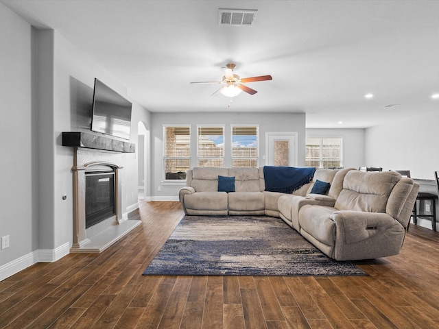 living area with plenty of natural light, wood finished floors, and visible vents