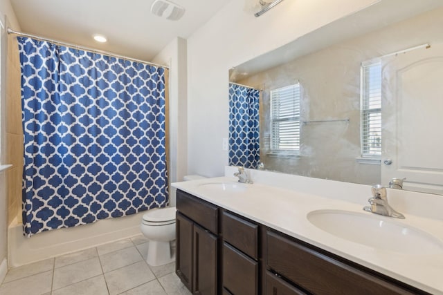 full bathroom featuring tile patterned flooring, visible vents, a sink, and toilet