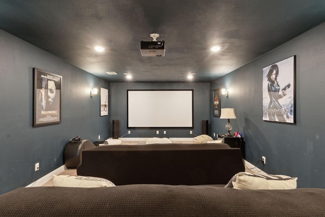 home theater room with recessed lighting and baseboards