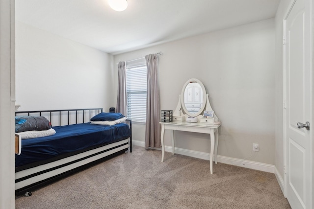 bedroom with carpet and baseboards