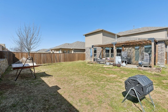 view of yard with a patio area, a fenced backyard, and a pergola