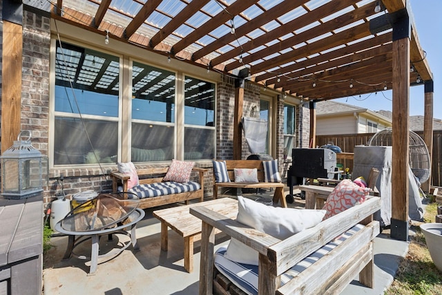 view of patio featuring fence, an outdoor living space, and a pergola