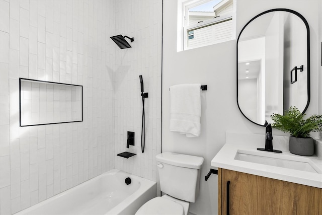 bathroom featuring vanity, toilet, and bathing tub / shower combination