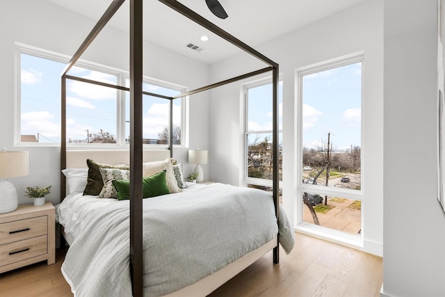 bedroom featuring visible vents, light wood-style flooring, and recessed lighting