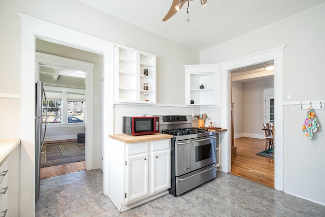 kitchen featuring wooden counters, open shelves, ceiling fan, stainless steel appliances, and white cabinets