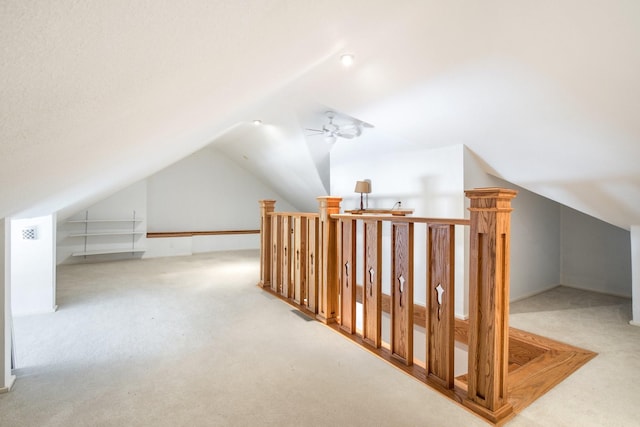 bonus room with ceiling fan, lofted ceiling, and carpet floors