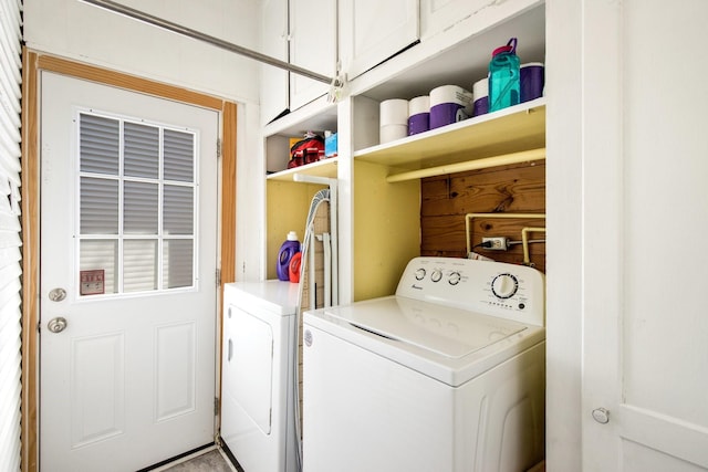 washroom with cabinet space and independent washer and dryer