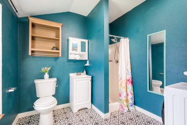 bathroom featuring toilet, a shower stall, washer / clothes dryer, and lofted ceiling