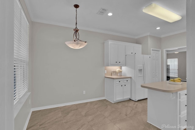 kitchen with light countertops, white refrigerator with ice dispenser, crown molding, and visible vents