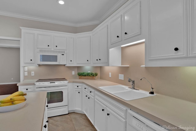 kitchen with a sink, white appliances, ornamental molding, and white cabinetry