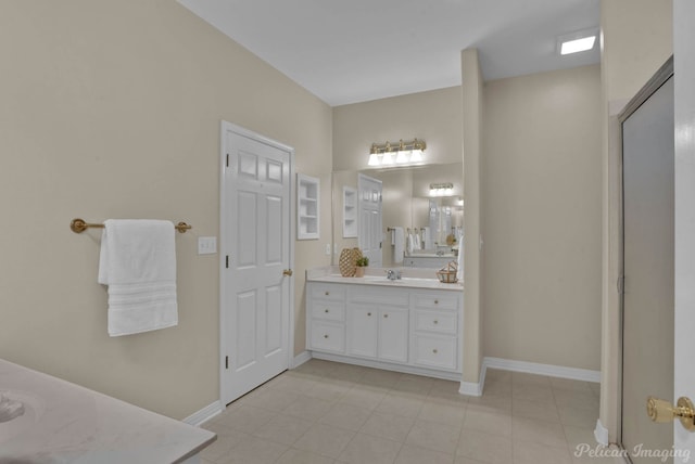 bathroom featuring vanity and baseboards