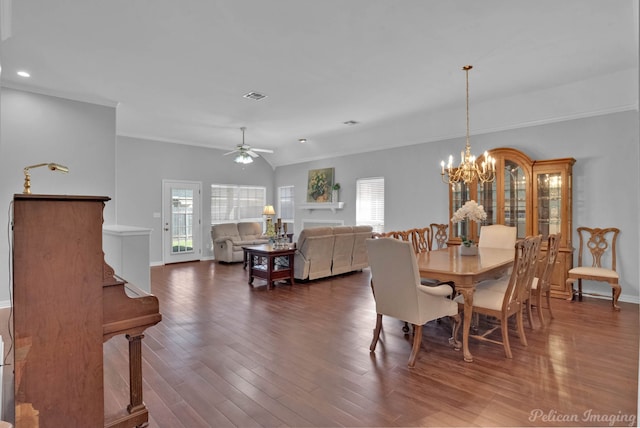 dining space featuring visible vents, ornamental molding, ceiling fan with notable chandelier, baseboards, and dark wood-style flooring