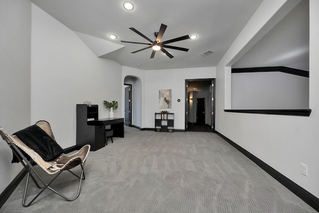 sitting room with baseboards, visible vents, arched walkways, and carpet flooring