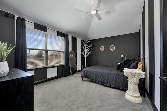 bedroom with carpet floors, lofted ceiling, baseboards, and a ceiling fan